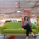 person-sitting-on-couch-with-laptop